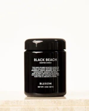 bluxom black beach candle in a matte black vessel inspired by Icelandic black sand beaches with sage, sea salt, and soft woods.